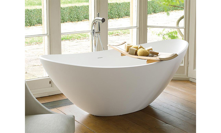 curved white bath tub from waters