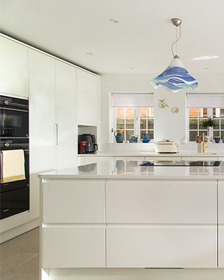 White handleless kitchen in a client's home.